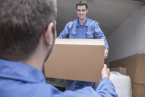 Moving van near elegant Holland Park residential buildings