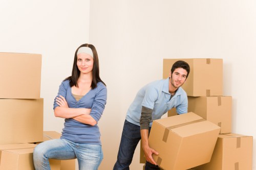 Packed boxes and furniture ready for man and van transport