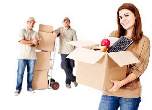 Professional movers loading furniture for a same day relocation