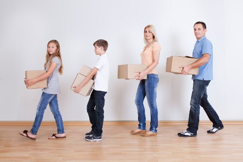 Removal team planning a family home move in Holland Park