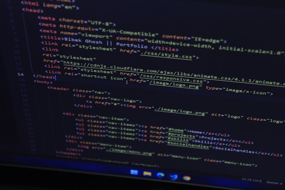 A close-up photograph of a computer screen displaying lines of code with multicoloured syntax highlights in red, green, blue, and purple on a dark background. The screen appears to be part of a home r